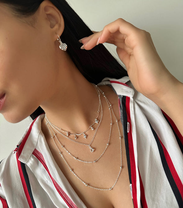 Colar duplo com coraçoes banhado a prata